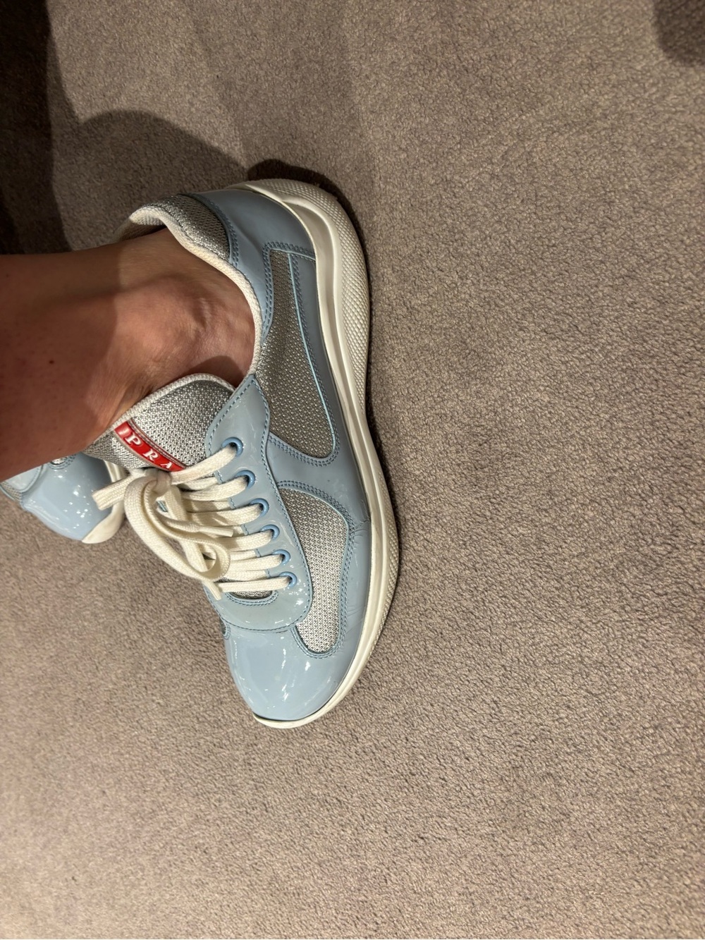 American cup light blue patented leather Prada sneakers